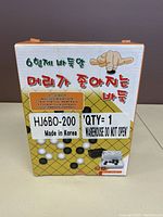 Front of the box showing brand 6Brothers, made in Korea label, image of Go board with black and white stones, Korean text, and a hand pointing.