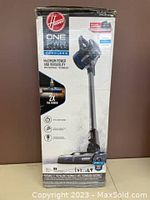 Vacuum in original box, front view showing Hoover branding and ONEPWR Blade Max label