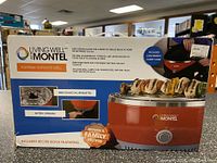 Front view of Living Well with Montel MWSG01 grill box showing the grill image, key features, and included accessories.