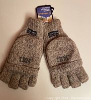 Pair of light brown ragg wool knit gloves with separate fingers and mitten flap covers shown top side up with Thinsulate tag visible.