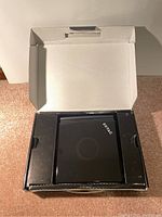 Open packaging box showing Zotac Zbox PC inside protective foam inserts.
