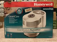 Photo of the original Honeywell QuietCare Cool Moisture Humidifier box showing product name, main features, and quieter operation note.