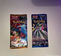 One Ancient Roar and one Future Flash unopened Pokémon card booster pack, foil sealed packets with Japanese text and Pokémon artwork