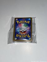 Photos show a plastic bag containing the cards, the backs of several cards with the classic Pokémon design, and a stacked view of the card faces featuring Japanese text, holographic designs and 1st edition marks.