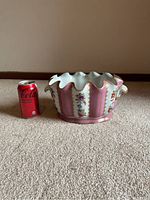 Front side view of planter next to a Coke can for scale.