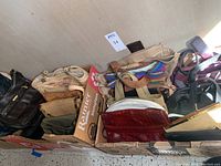 Full view of assorted vintage purses and bags inside boxes.