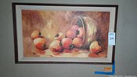 Framed painting of persimmons in warm earthy tones, showing the full artwork and frame.