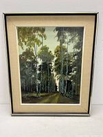 Front view of framed oil painting of birch trees