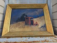 Framed oil painting of a haunting landscape with a red tractor, by J Beckell.