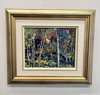 Frontal view of framed painting showing impressionist forest scene