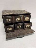 Front view of the antique vargueno box with drawers open showing detailed inlay and aged wood.