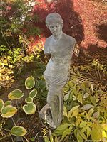 Front view of statue showing torso and base