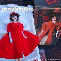 Silken Flame Barbie doll in original packaging showing porcelain face, red dress, and original box.