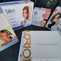 All five boxed items grouped on black backdrop