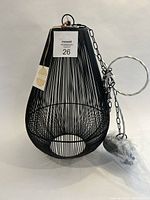 Photo of black metal cage hanging pendant light with chain and electrical cord