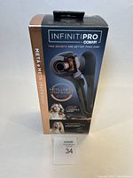 Boxed Conair Infiniti Pro Meta & Meta Hair hair curler and straightener showing front with product image and text.
