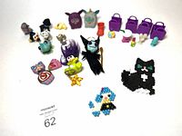 Overview of the assortment of small toys including Shopkins, monsters, and other figures, plus shopping bag keychains