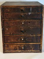 Front view of wooden cabinet with six drawers