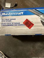 Mastercraft branded box for belt drive garage door opener, showing product name and bilingual text.
