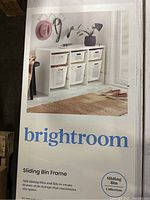 Photo of the Brightroom sliding bin frame product box with image of the assembled frame and bins.