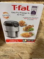 Front view of the T-fal Easy Fry Prestige XL air fryer box displaying the product image and capacity 4.2L.