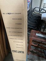 Original shipping box of the umbrella showing brand and stock information.