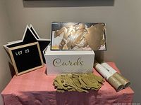 Full lot overview including wooden card box, gold letters, fabric banner, wrapping paper rolls, and star-shaped letter board