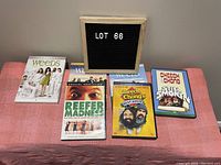 Photo of DVD collection including three Weeds TV series seasons, Reefer Madness, and two Cheech & Chong movies.