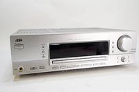 Front angle view of JVC RX-5032Vsl home theater receiver showing the silver metal front panel with multiple buttons, a large volume knob, and display window.