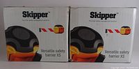 Two retail boxes for Skipper Versatile Safety Barrier XS units showing product image and brand text