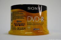 Side label of the Sony DVD-R spindle showing 'DVD-R, Excellent Performance and Reliability' with packaging details and brand logo.