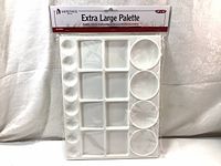 Front view of the new sealed Heritage Extra Large Paint Palette showing layout of circular and square wells and packaging.