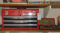 Red Craftsman three drawer toolbox and vintage Quickway socket set side by side