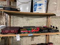 Full shelf overview showing all locomotives, tenders, passenger cars and hoppers