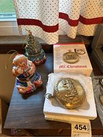 Original boxed Mr. Christmas Pocketwatch musical and animated clock with two additional Christmas-themed ornaments, Santa Claus and Christmas tree.
