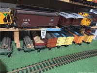 Top and bottom shelves showing full lot with sign