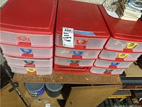 Plastic storage drawers with colorful handles labeled 'Train Scene Accessories w/cases'