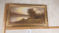 Front view of framed pastel painting showing the full river landscape scene with ornate gold-tone frame.