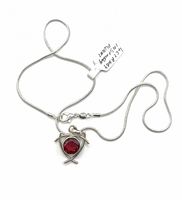 Pendant and chain laid out showing clasp and chain style