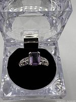 Ring displayed in clear acrylic display box