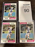 Front of three 1973 Nolan Ryan baseball cards from California Angels in protective sleeves with seller number 90 card.