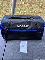 Closed Kobalt tool bag showing logo and carrying handle.