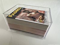 Stack of approximately 60 sports cards in a clear plastic protective case, with the top card featuring baseball player Tony Gwynn from the Padres.