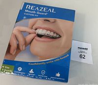 Front of Reazeal mouth guard packaging showing product image and branding.