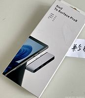 Box packaging showing the text '5in2 To Surface Pro 8' and listed ports HDMI, USB-A x1, USB-C x1, TF x1 with an image of the docking station connected to a Surface Pro device.