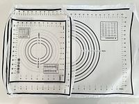 Three pastry mats laid flat, showing printed measurement lines and concentric circle guides.