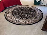 Full top-down view of the 8-foot round rug showing the intricate floral and vine patterns and neutral color palette.