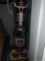 Front view of Shark upright vacuum cleaner showing the clear dustbin with anti-allergen complete seal label and branding.
