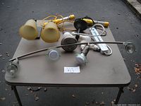 Full view of the lot showing ceiling track light, wall sconces, work lights, power strip, and ceiling light fixture parts