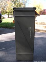 Full side view of the green metal ammo can showing dimensions and stencil code markings